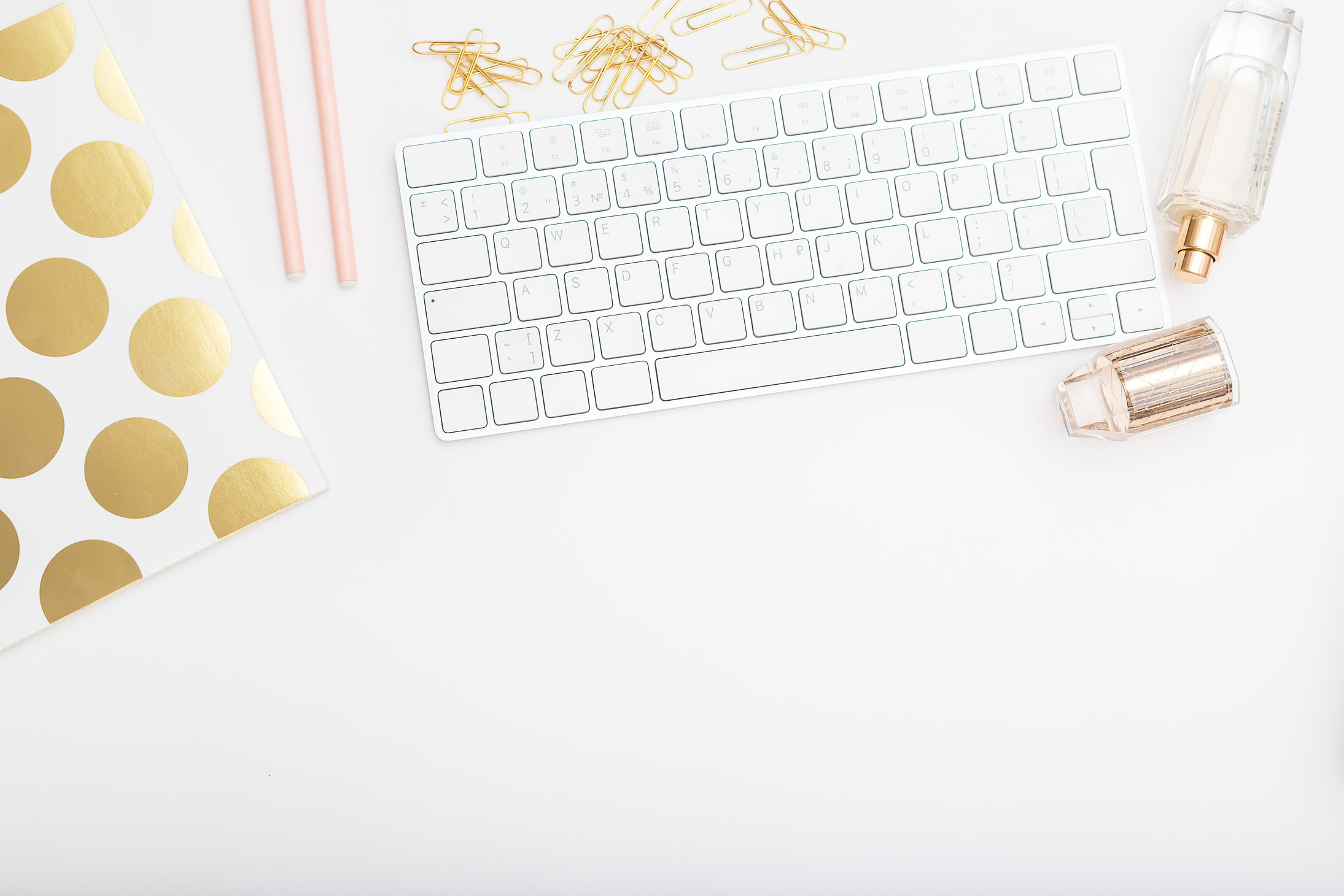 Feminine Desk with Pink and Gold Objects 